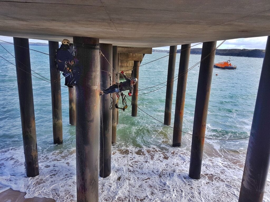 Painting legs of RNLI lifeboat Station